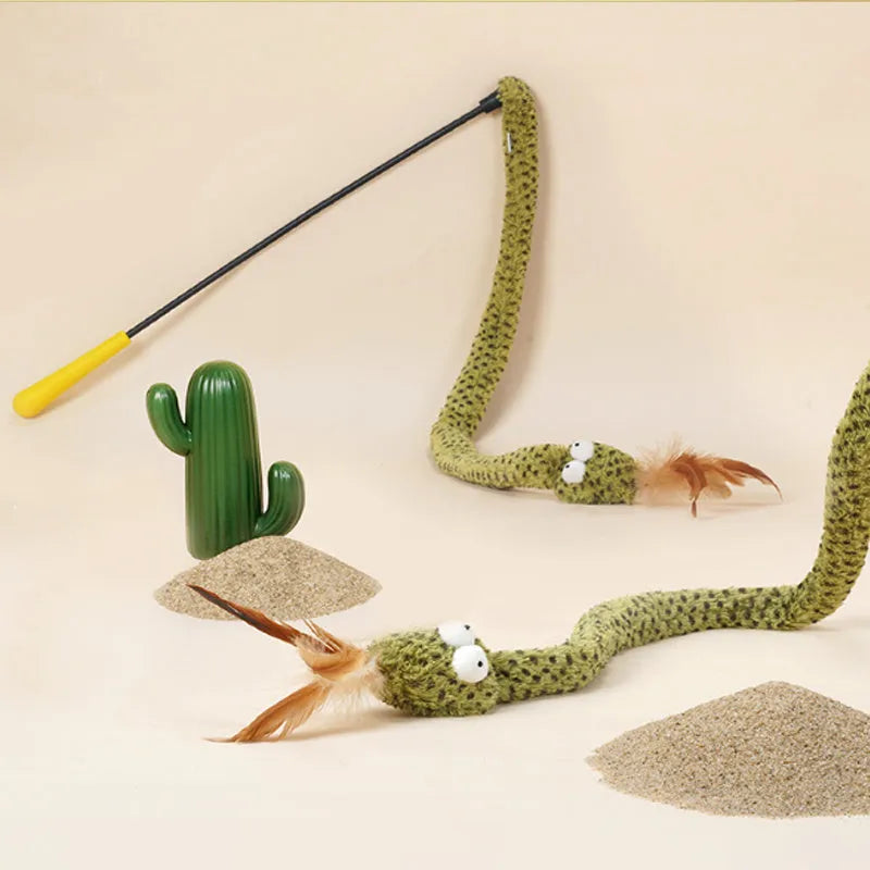 Long green snake cat teasing stick toy with feather end for cat play.