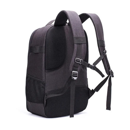Black Oxford cloth waterproof backpack open to show internal camera, laptop, and organiser pockets