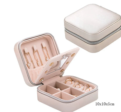 Three-layer travel jewellery box with PU leather exterior and secure closure for organised accessory storage