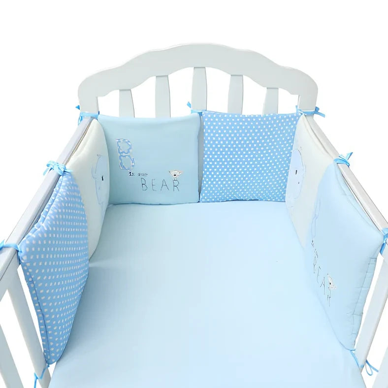 Six 30x30cm cotton baby bed protection panels with hard cotton filling arranged around crib
