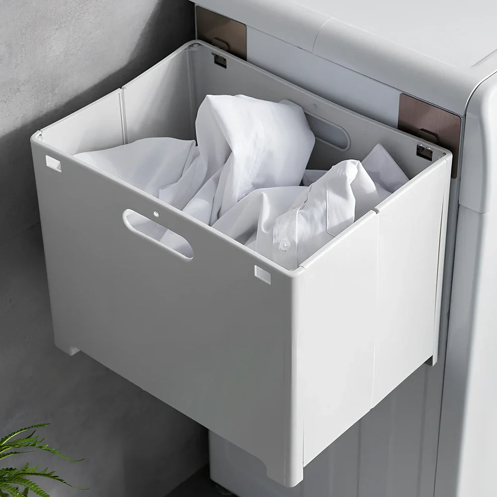 White wall-mounted bathroom storage cabinet with integrated table surface for laundry organisation