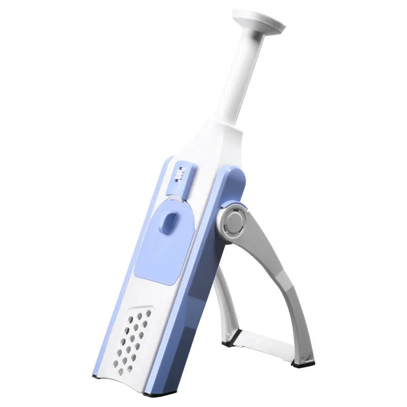 White and blue multifunctional vegetable slicer with stainless steel blades on a kitchen counter.