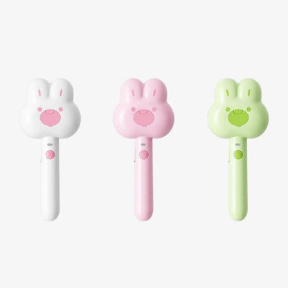 Rechargeable cat grooming comb with steam function in cartoon design, showing long handle and brush head