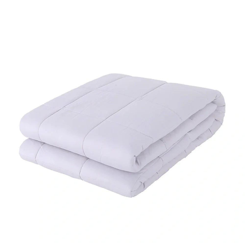 Weighted blanket with quilted compartments containing glass beads, available in dark grey, light grey, and navy colours