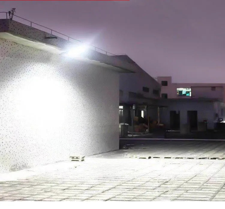 Black solar motion sensor security light for outdoor garden or fence installation with IP65 waterproof rating