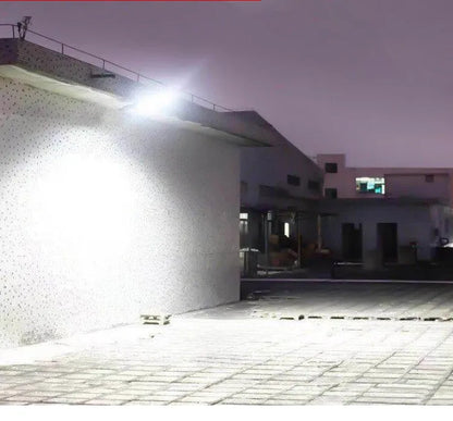 Black solar motion sensor security light for outdoor garden or fence installation with IP65 waterproof rating