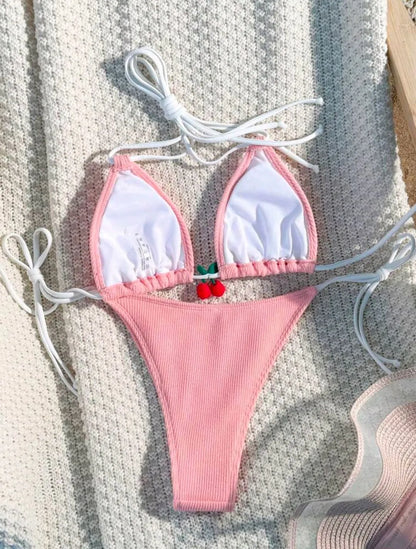 Solid colour briefs-style bikini swimsuit on a hanger, showing the top and pants.