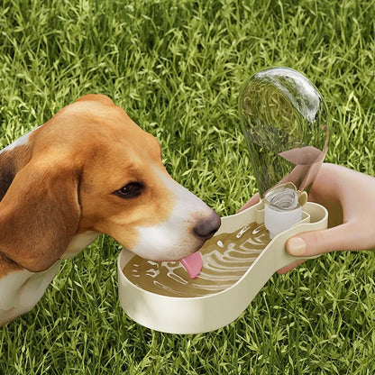 Orange and white portable pet water feeder showing water bottle and food container compartments with carrying sling