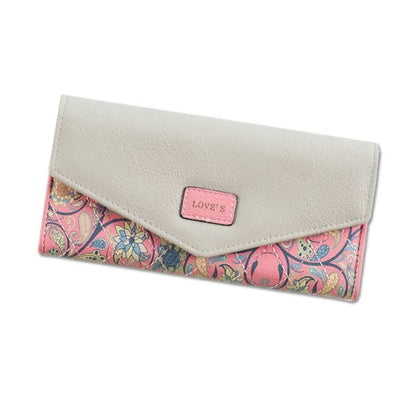 Three-fold leather wallet with buckle closure showing black colour variant, note clip visible inside compartment