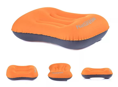 Compact inflatable travel pillow in peacock blue, bright orange, or green for camping and outdoor use