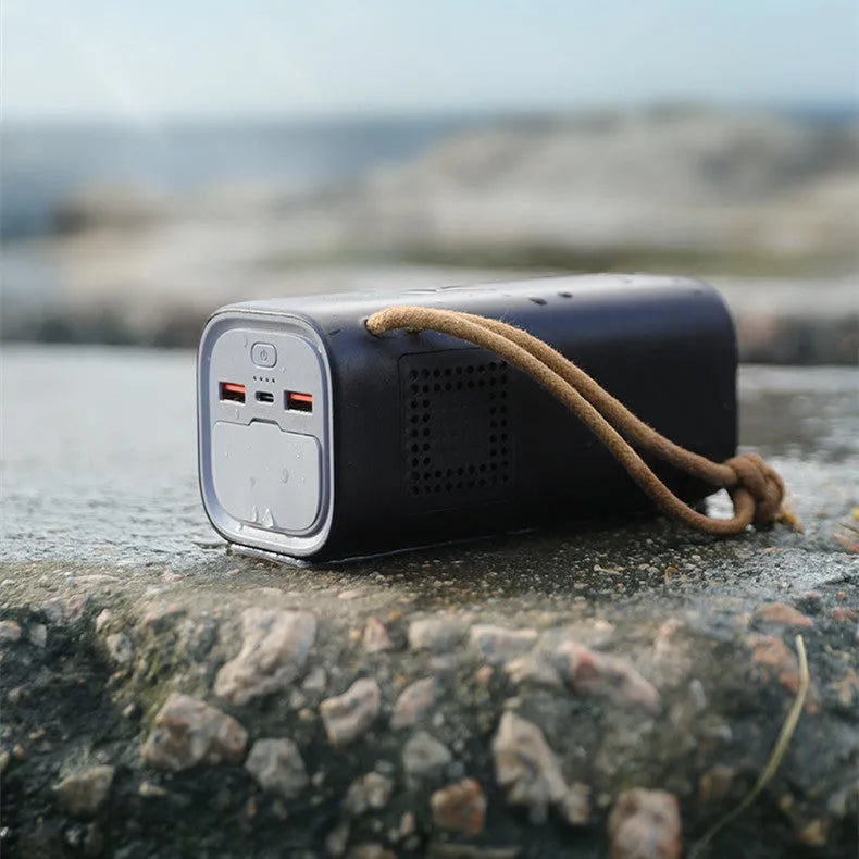 Black battery emergency power bank with solar panel, 70mm by 70mm by 162mm, showing 200W output and charging ports