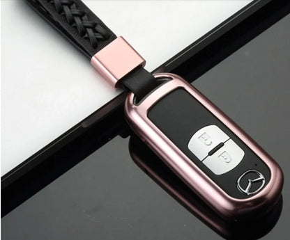 Aluminum alloy key case for Mazda with CNC engraving, available in sapphire, blue, grey, and rose gold