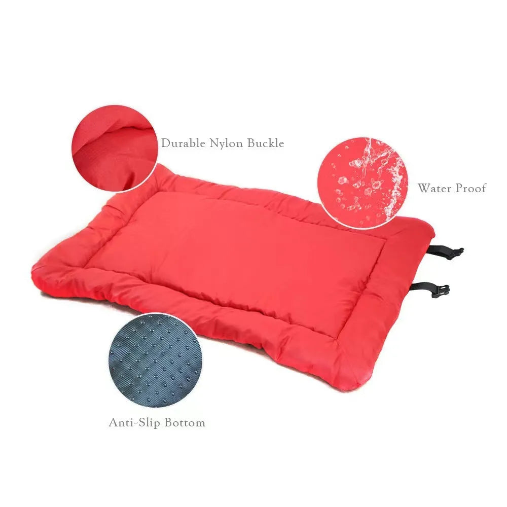 Blue foldable outdoor dog bed shown both open and folded with nylon buckles, on a grassy background.