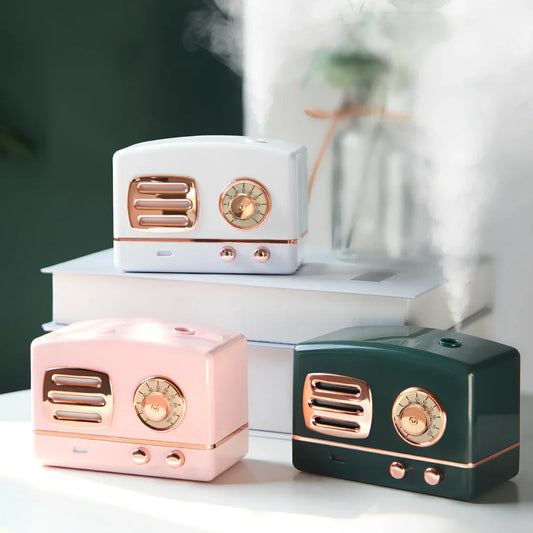 Green retro humidifier with bronzing finish measuring 9.5cm tall on wooden desk