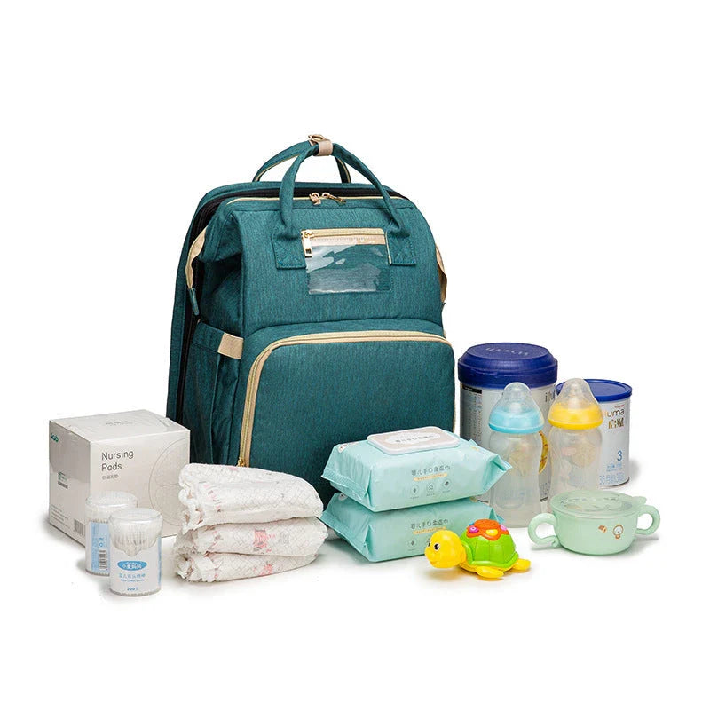 Versatile baby changing backpack with USB charging port and folding portable bed