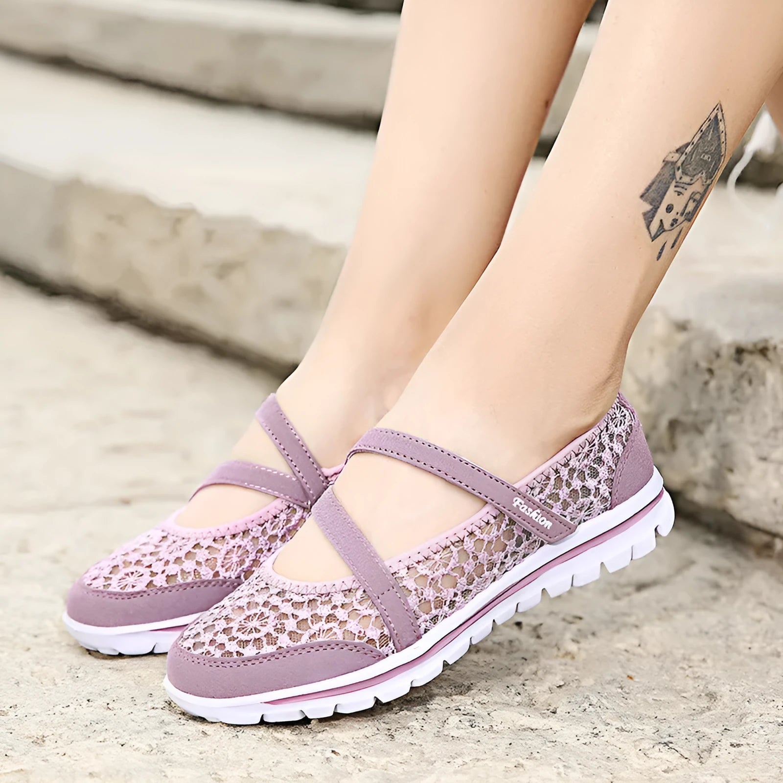 Women's beige mesh lace-up flat shoes with round toe and sewing line detail on a white background.