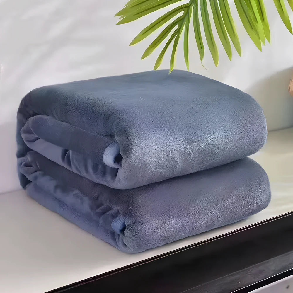 Coral fleece flannel blanket in beige showing textured surface and consistent edges