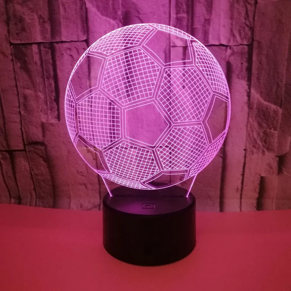 3D football-shaped LED night light showing colourful gradient illumination on a dark background
