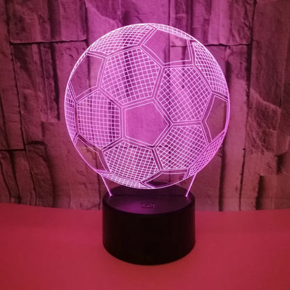 3D football-shaped LED night light showing colourful gradient illumination on a dark background