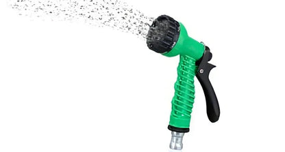 Blue telescopic water hose with high-pressure gun, expanded for use in garden watering
