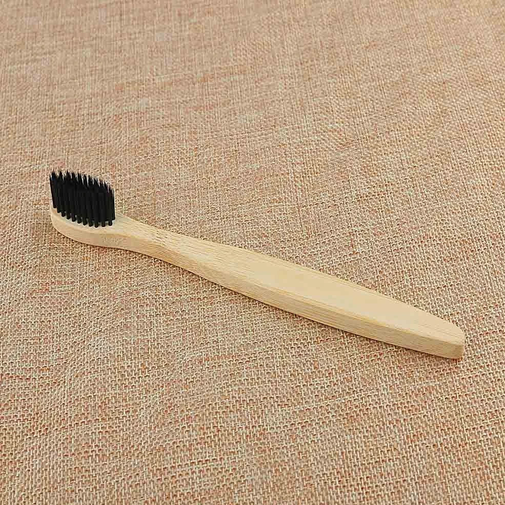 Organic bamboo toothbrush with 17.5cm ergonomic handle and charcoal-infused bristles for sustainable dental care