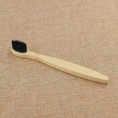 Organic bamboo toothbrush with 17.5cm ergonomic handle and charcoal-infused bristles for sustainable dental care