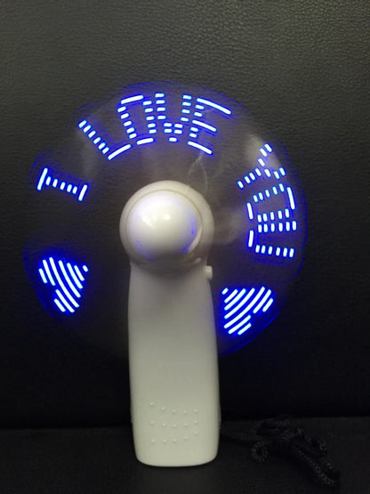 White handheld fan with LED love pattern display showing blue and red lights, measuring 10.8cm tall