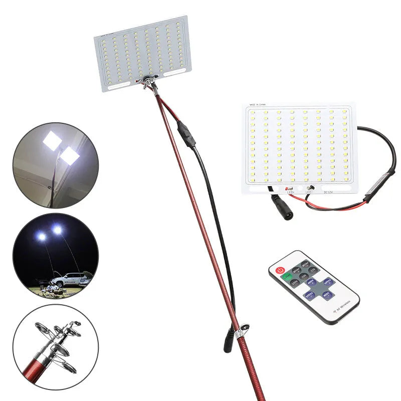 White LED fishing light on a tall telescopic pole, with a 12V battery clip cable and remote controller on grass.