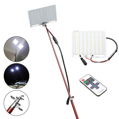 White LED fishing light on a tall telescopic pole, with a 12V battery clip cable and remote controller on grass.