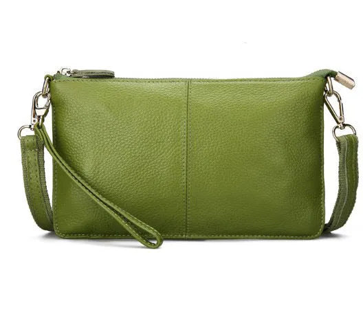 Lady's cowhide slant bag in apricot colour showing front view with strap and compact 24 cm size.