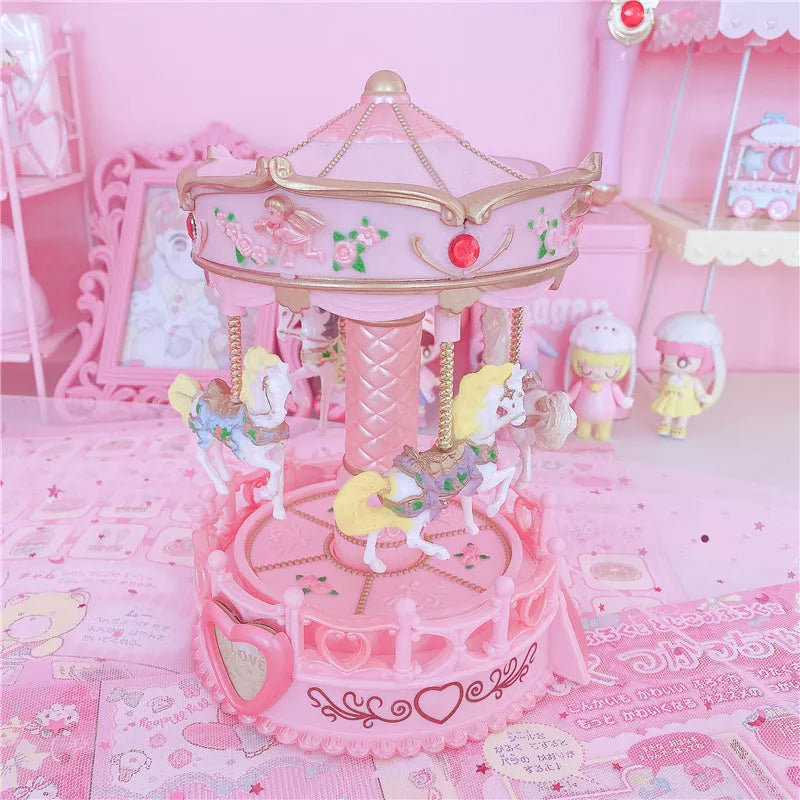 Carousel music box with pink design, clockwork movement, and light, dimensions 15.5x15.5x24 cm