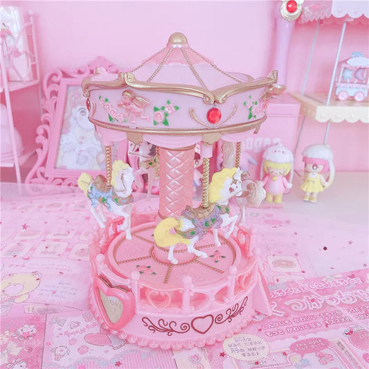 Carousel music box with pink design, clockwork movement, and light, dimensions 15.5x15.5x24 cm