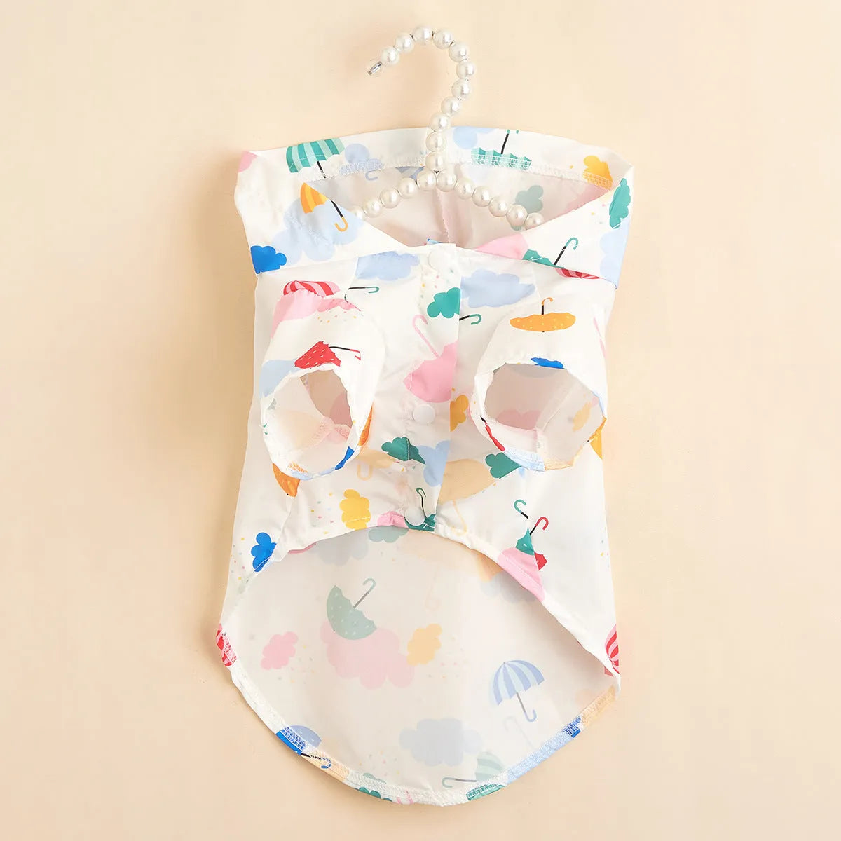 Colourful cartoon umbrella pattern pet raincoat for dogs and cats, shown in size L.