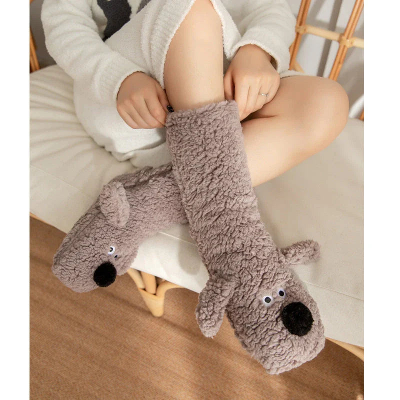 Cozy cartoon dog socks in various colors featuring plush, non-slip designs for comfortable winter wear