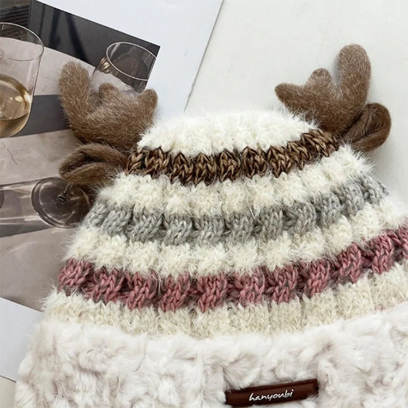 Cozy knit Christmas hat with playful deer antler design in various festive colors