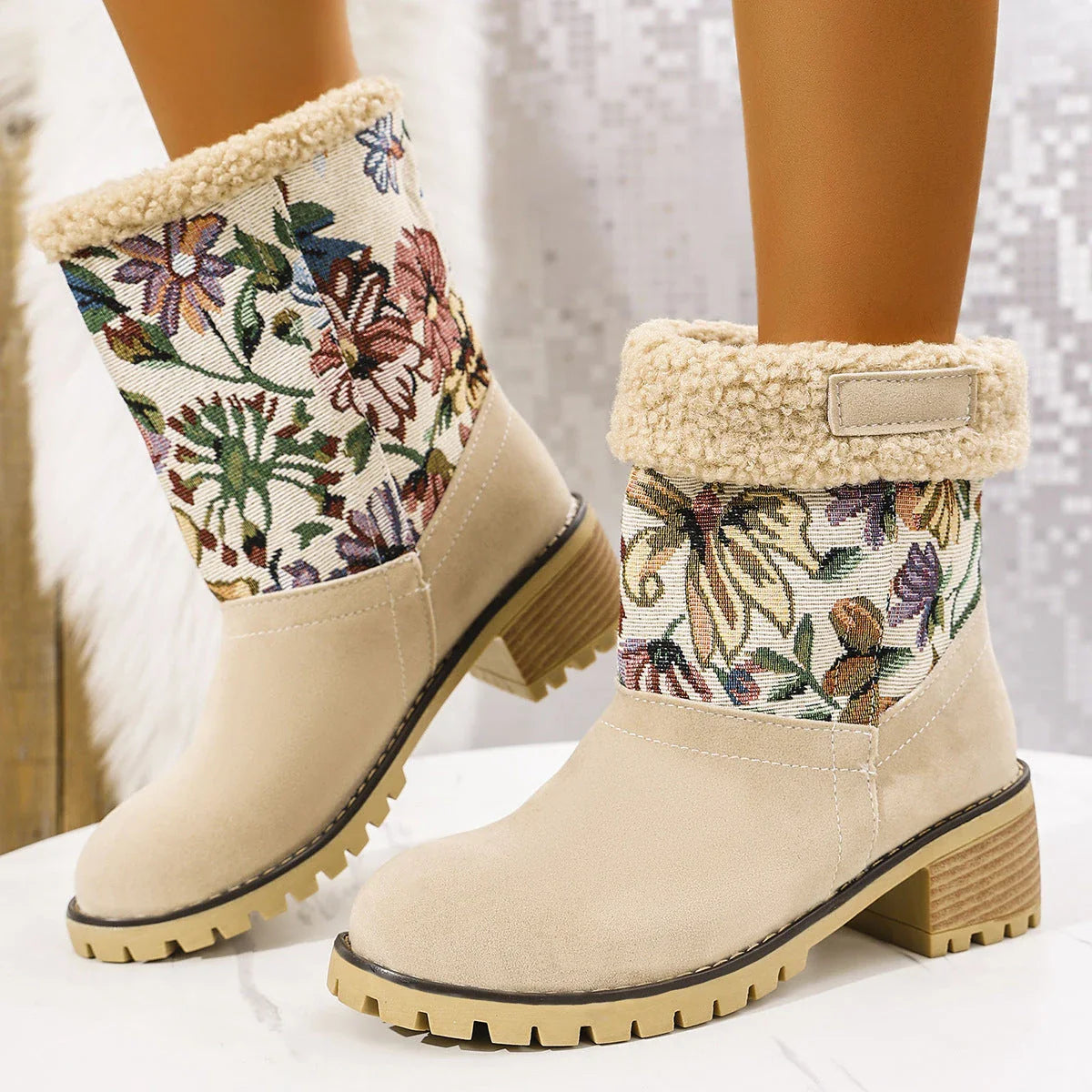 Floral embroidered snow boots in off-white, black, and pink colors with thick square heels and round toe shape