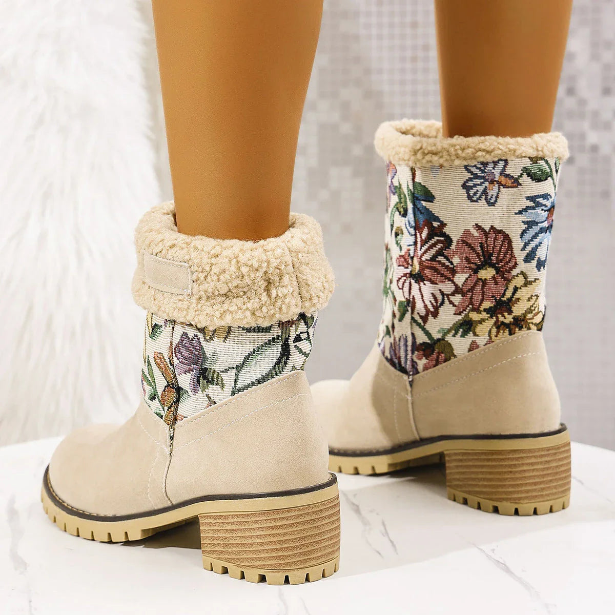Floral embroidered snow boots in off-white, black, and pink colors with thick square heels and round toe shape