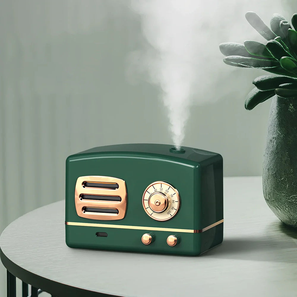 Green retro humidifier with bronzing finish measuring 9.5cm tall on wooden desk