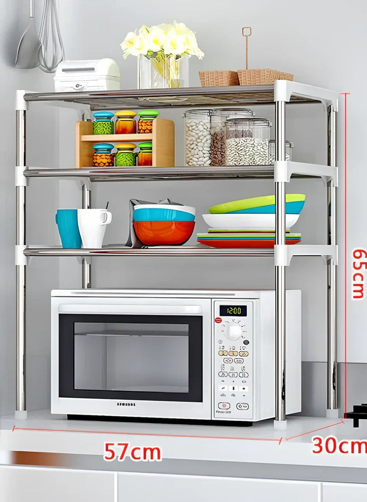 Silver and white microwave shelf rack with iron tubes and plastic connectors measuring 56.9cm wide