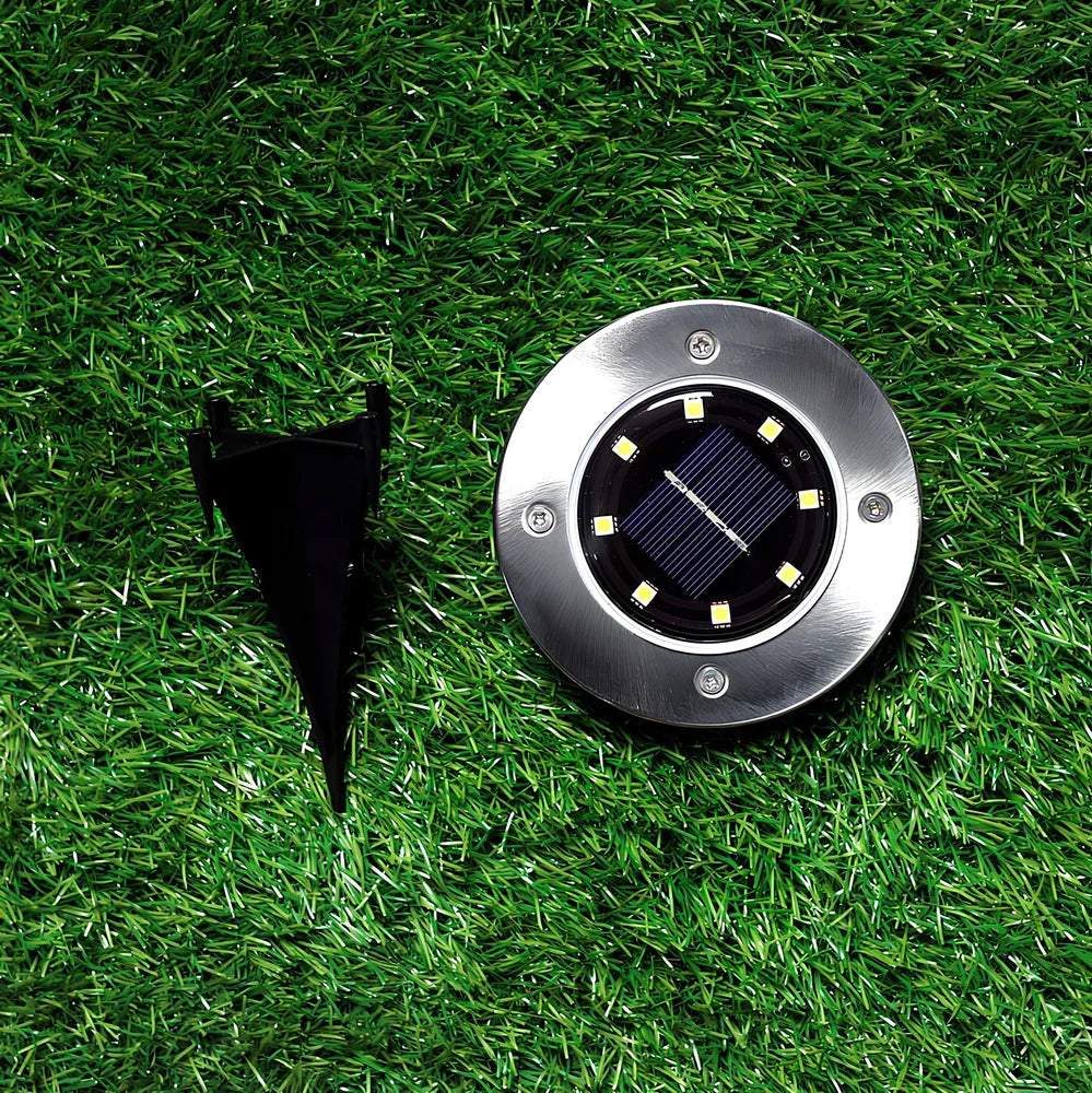 Stainless steel solar garden light with LED illumination for outdoor landscape lighting