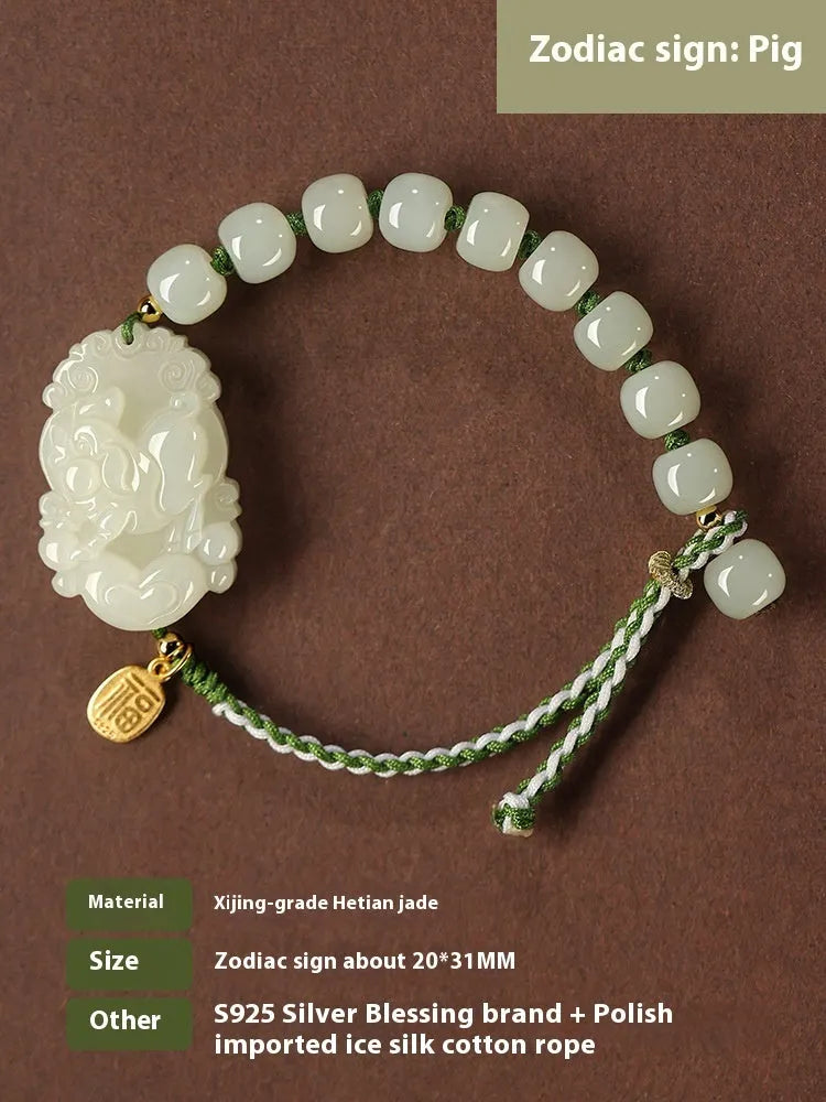Hetian jade bracelet with a rabbit zodiac charm and S925 silver card on a red ice cotton rope.