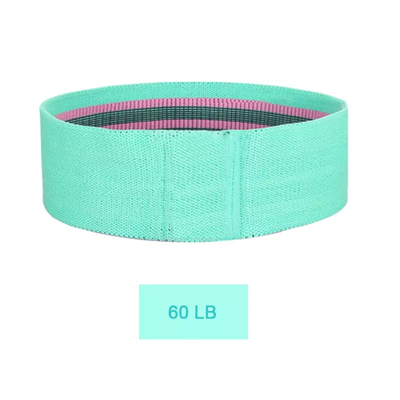 Squat resistance band hip ring in pink, purple, and green for lower body workouts