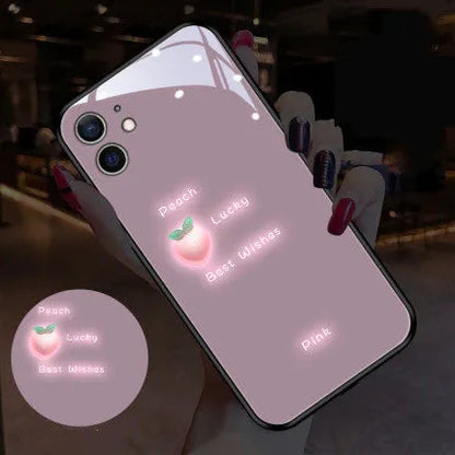 White luminous iPhone case with purple daisy design showing voice-activated colour light illumination around edges