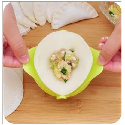 Plastic dumpling maker device in blue, green, and white for quick, uniform dumplings