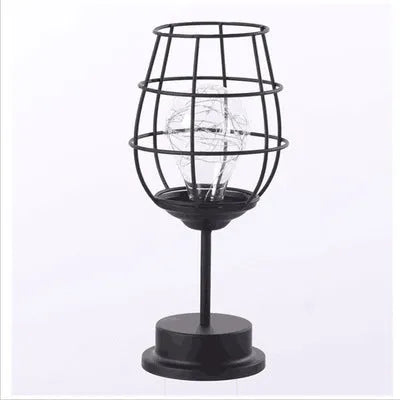 Minimalist hollow iron table lamp with warm white LED light in red wine glass design