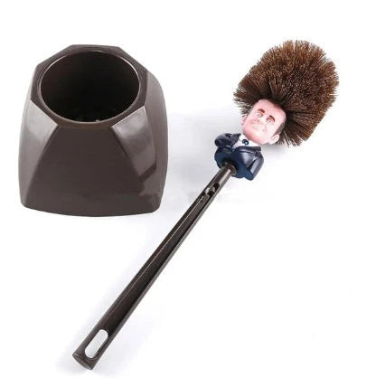 Comical Donald Trump-themed toilet brush made of durable plastic with a bold yellow color and convenient hanging slot