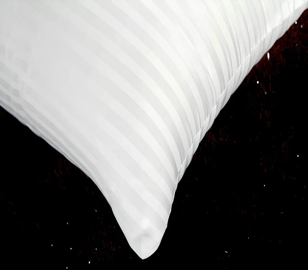 White square healthcare pillow measuring 40x70cm with polyester fibre filling