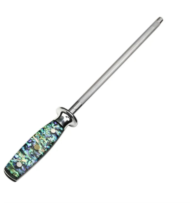 Household knife sharpener with high carbon steel blade and abalone shell handle on a kitchen counter.