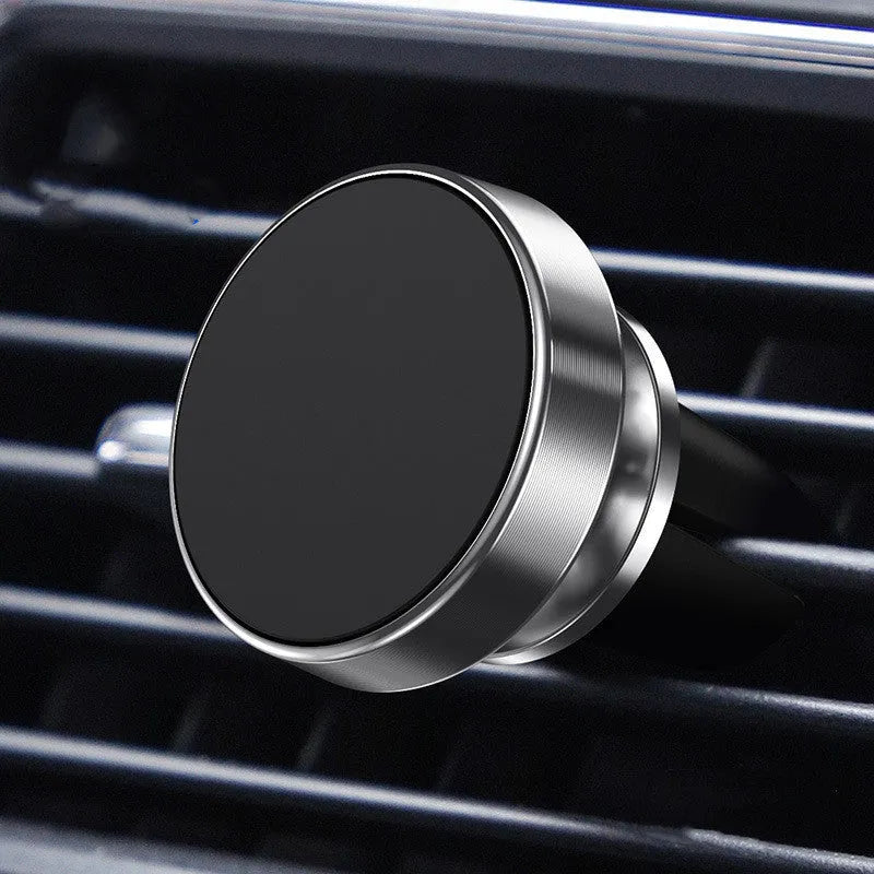Aluminium alloy magnetic car phone holder mounted in a CD slot, holding a smartphone at an adjustable angle.