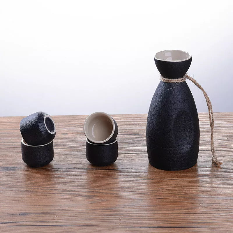 Sakura vintage sake set with ceramic kettle, wine glass, and triangle pot in traditional Japanese design